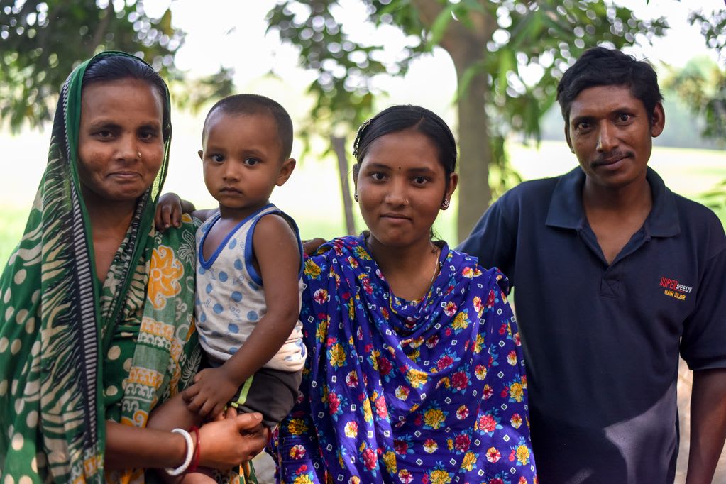 Ratna poses alongside her parents and one of her younger siblings.